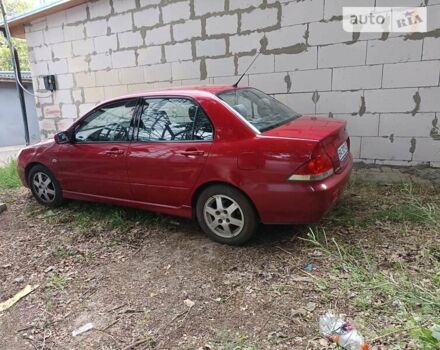 Червоний Міцубісі Lancer, об'ємом двигуна 1.58 л та пробігом 200 тис. км за 3400 $, фото 1 на Automoto.ua