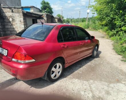 Красный Мицубиси Лансер, объемом двигателя 1 л и пробегом 2 тыс. км за 3100 $, фото 6 на Automoto.ua