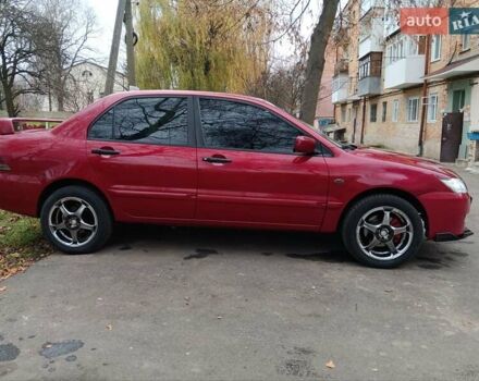 Червоний Міцубісі Lancer, об'ємом двигуна 1.3 л та пробігом 223 тис. км за 4250 $, фото 11 на Automoto.ua
