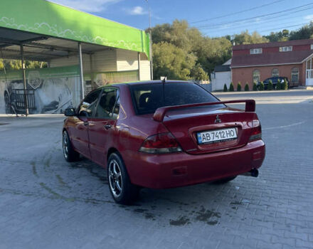 Червоний Міцубісі Lancer, об'ємом двигуна 1.3 л та пробігом 219 тис. км за 3600 $, фото 2 на Automoto.ua