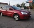 Червоний Міцубісі Lancer, об'ємом двигуна 1.58 л та пробігом 250 тис. км за 2999 $, фото 1 на Automoto.ua