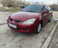 Червоний Міцубісі Lancer, об'ємом двигуна 1.6 л та пробігом 310 тис. км за 4500 $, фото 1 на Automoto.ua