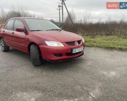 Красный Мицубиси Лансер, объемом двигателя 1.3 л и пробегом 250 тыс. км за 3450 $, фото 3 на Automoto.ua