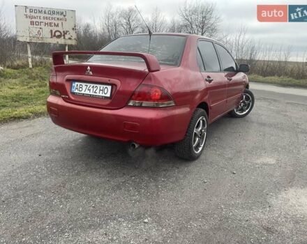 Красный Мицубиси Лансер, объемом двигателя 1.3 л и пробегом 250 тыс. км за 3450 $, фото 1 на Automoto.ua