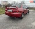 Красный Мицубиси Лансер, объемом двигателя 1.3 л и пробегом 250 тыс. км за 3450 $, фото 1 на Automoto.ua