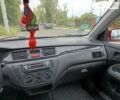 Червоний Міцубісі Lancer, об'ємом двигуна 1.58 л та пробігом 200 тис. км за 3400 $, фото 18 на Automoto.ua