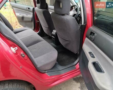 Червоний Міцубісі Lancer, об'ємом двигуна 1.3 л та пробігом 223 тис. км за 4250 $, фото 31 на Automoto.ua