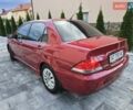 Червоний Міцубісі Lancer, об'ємом двигуна 1.6 л та пробігом 249 тис. км за 5200 $, фото 4 на Automoto.ua