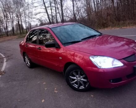 Красный Мицубиси Лансер, объемом двигателя 1.6 л и пробегом 450 тыс. км за 2850 $, фото 1 на Automoto.ua