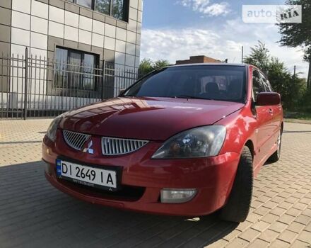 Червоний Міцубісі Lancer, об'ємом двигуна 2 л та пробігом 214 тис. км за 5400 $, фото 11 на Automoto.ua