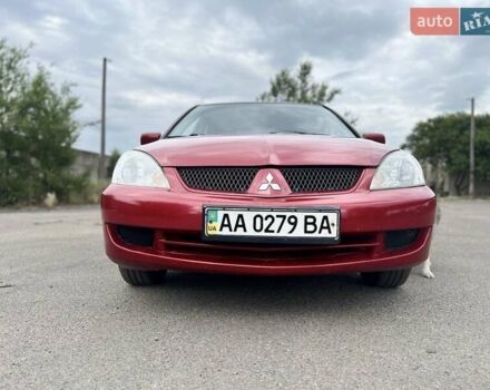 Красный Мицубиси Лансер, объемом двигателя 1.58 л и пробегом 250 тыс. км за 3999 $, фото 4 на Automoto.ua