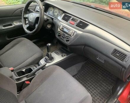 Красный Мицубиси Лансер, объемом двигателя 1.58 л и пробегом 250 тыс. км за 3999 $, фото 25 на Automoto.ua