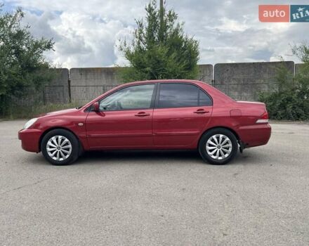 Красный Мицубиси Лансер, объемом двигателя 1.58 л и пробегом 250 тыс. км за 3999 $, фото 2 на Automoto.ua