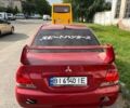 Красный Мицубиси Лансер, объемом двигателя 1.6 л и пробегом 290 тыс. км за 3000 $, фото 1 на Automoto.ua