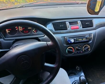 Красный Мицубиси Лансер, объемом двигателя 1.6 л и пробегом 450 тыс. км за 2850 $, фото 5 на Automoto.ua