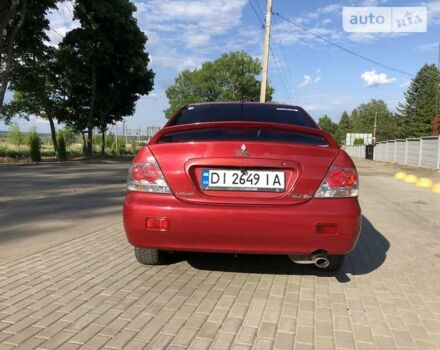 Червоний Міцубісі Lancer, об'ємом двигуна 2 л та пробігом 214 тис. км за 5400 $, фото 4 на Automoto.ua