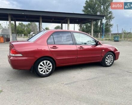 Красный Мицубиси Лансер, объемом двигателя 1.58 л и пробегом 250 тыс. км за 3999 $, фото 10 на Automoto.ua