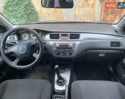 Красный Мицубиси Лансер, объемом двигателя 1.58 л и пробегом 250 тыс. км за 3999 $, фото 18 на Automoto.ua