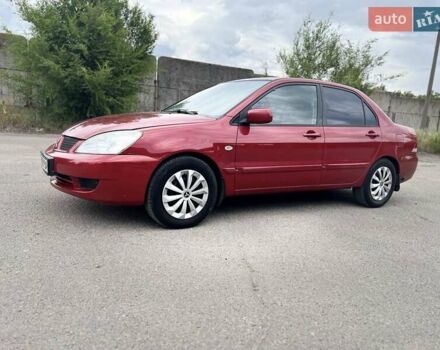 Красный Мицубиси Лансер, объемом двигателя 1.58 л и пробегом 250 тыс. км за 3999 $, фото 1 на Automoto.ua
