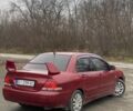 Красный Мицубиси Лансер, объемом двигателя 1.6 л и пробегом 186 тыс. км за 4000 $, фото 1 на Automoto.ua