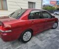 Червоний Міцубісі Lancer, об'ємом двигуна 1.6 л та пробігом 249 тис. км за 5200 $, фото 3 на Automoto.ua