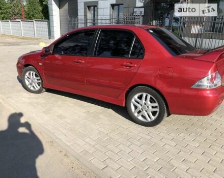 Червоний Міцубісі Lancer, об'ємом двигуна 2 л та пробігом 214 тис. км за 5400 $, фото 2 на Automoto.ua