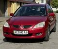 Красный Мицубиси Лансер, объемом двигателя 1.6 л и пробегом 222 тыс. км за 4300 $, фото 1 на Automoto.ua