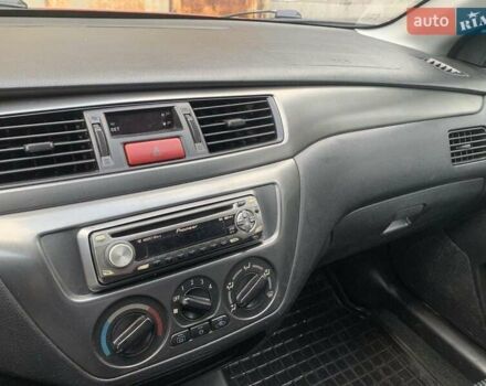 Красный Мицубиси Лансер, объемом двигателя 1.58 л и пробегом 250 тыс. км за 3999 $, фото 21 на Automoto.ua