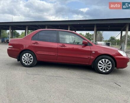 Красный Мицубиси Лансер, объемом двигателя 1.58 л и пробегом 250 тыс. км за 3999 $, фото 7 на Automoto.ua