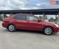 Красный Мицубиси Лансер, объемом двигателя 1.58 л и пробегом 250 тыс. км за 3999 $, фото 7 на Automoto.ua