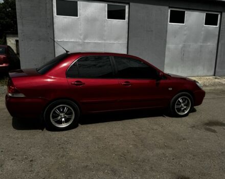 Червоний Міцубісі Lancer, об'ємом двигуна 1.6 л та пробігом 250 тис. км за 4050 $, фото 4 на Automoto.ua
