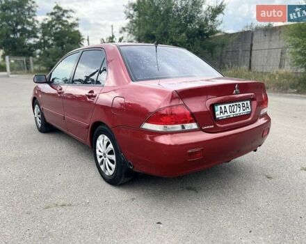 Красный Мицубиси Лансер, объемом двигателя 1.58 л и пробегом 250 тыс. км за 3999 $, фото 5 на Automoto.ua