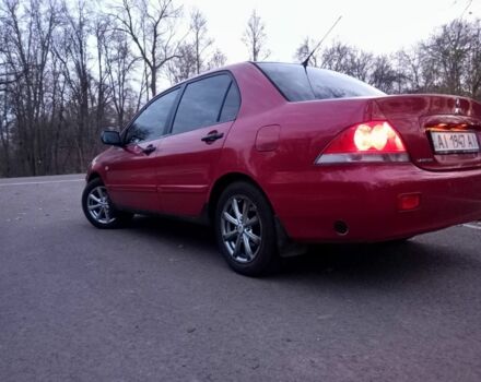 Красный Мицубиси Лансер, объемом двигателя 1.6 л и пробегом 450 тыс. км за 2850 $, фото 4 на Automoto.ua