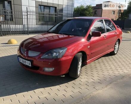 Червоний Міцубісі Lancer, об'ємом двигуна 2 л та пробігом 214 тис. км за 5400 $, фото 12 на Automoto.ua