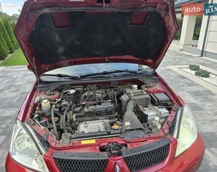 Червоний Міцубісі Lancer, об'ємом двигуна 1.6 л та пробігом 249 тис. км за 5200 $, фото 30 на Automoto.ua