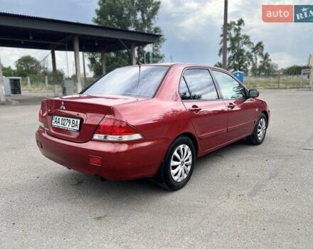 Красный Мицубиси Лансер, объемом двигателя 1.58 л и пробегом 250 тыс. км за 3999 $, фото 11 на Automoto.ua