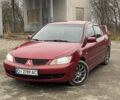 Красный Мицубиси Лансер, объемом двигателя 1.6 л и пробегом 186 тыс. км за 4000 $, фото 1 на Automoto.ua