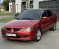 Красный Мицубиси Лансер, объемом двигателя 1.6 л и пробегом 330 тыс. км за 3250 $, фото 1 на Automoto.ua