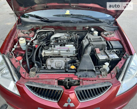 Червоний Міцубісі Lancer, об'ємом двигуна 1.6 л та пробігом 286 тис. км за 4900 $, фото 24 на Automoto.ua