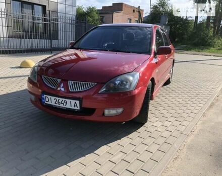 Червоний Міцубісі Lancer, об'ємом двигуна 2 л та пробігом 214 тис. км за 5400 $, фото 1 на Automoto.ua