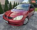 Червоний Міцубісі Lancer, об'ємом двигуна 1.6 л та пробігом 249 тис. км за 5200 $, фото 10 на Automoto.ua