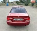 Красный Мицубиси Лансер, объемом двигателя 1.58 л и пробегом 250 тыс. км за 3999 $, фото 3 на Automoto.ua