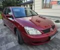 Червоний Міцубісі Lancer, об'ємом двигуна 1.6 л та пробігом 249 тис. км за 5200 $, фото 5 на Automoto.ua