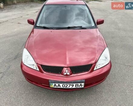 Красный Мицубиси Лансер, объемом двигателя 1.58 л и пробегом 250 тыс. км за 3999 $, фото 12 на Automoto.ua