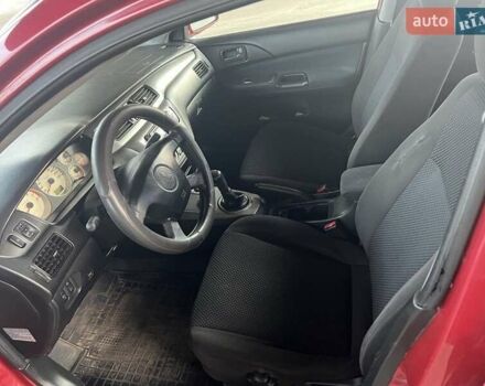 Красный Мицубиси Лансер, объемом двигателя 1.58 л и пробегом 250 тыс. км за 3999 $, фото 24 на Automoto.ua