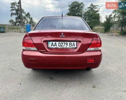 Красный Мицубиси Лансер, объемом двигателя 1.58 л и пробегом 250 тыс. км за 3999 $, фото 13 на Automoto.ua