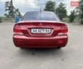 Красный Мицубиси Лансер, объемом двигателя 1.58 л и пробегом 250 тыс. км за 3999 $, фото 13 на Automoto.ua