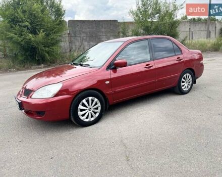 Красный Мицубиси Лансер, объемом двигателя 1.58 л и пробегом 250 тыс. км за 3999 $, фото 9 на Automoto.ua