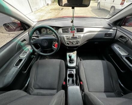 Червоний Міцубісі Lancer, об'ємом двигуна 1.6 л та пробігом 250 тис. км за 4050 $, фото 13 на Automoto.ua
