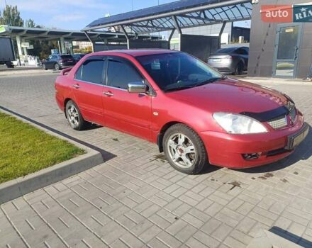 Красный Мицубиси Лансер, объемом двигателя 1.6 л и пробегом 73 тыс. км за 5500 $, фото 7 на Automoto.ua